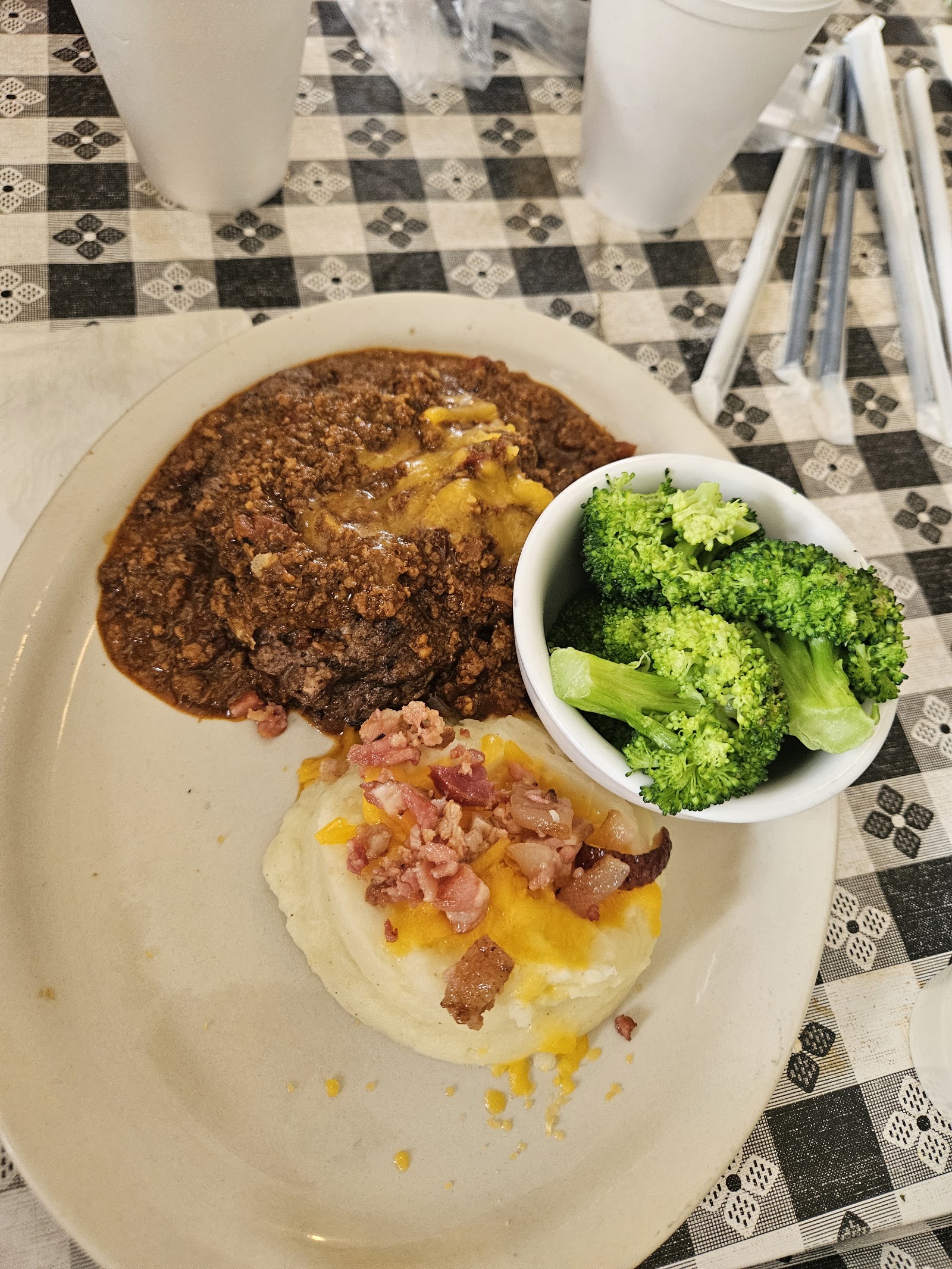 Hamburger steak plate with mashed potatoes and steamed broccoli