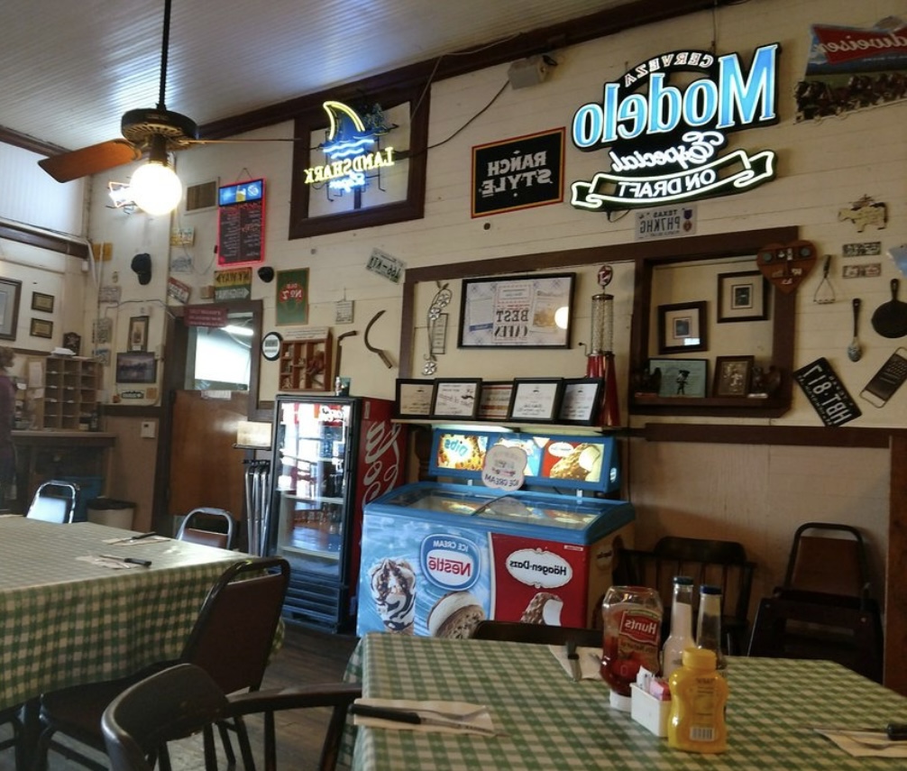 Interior wall decor and drink cooler at Blake's Cafe